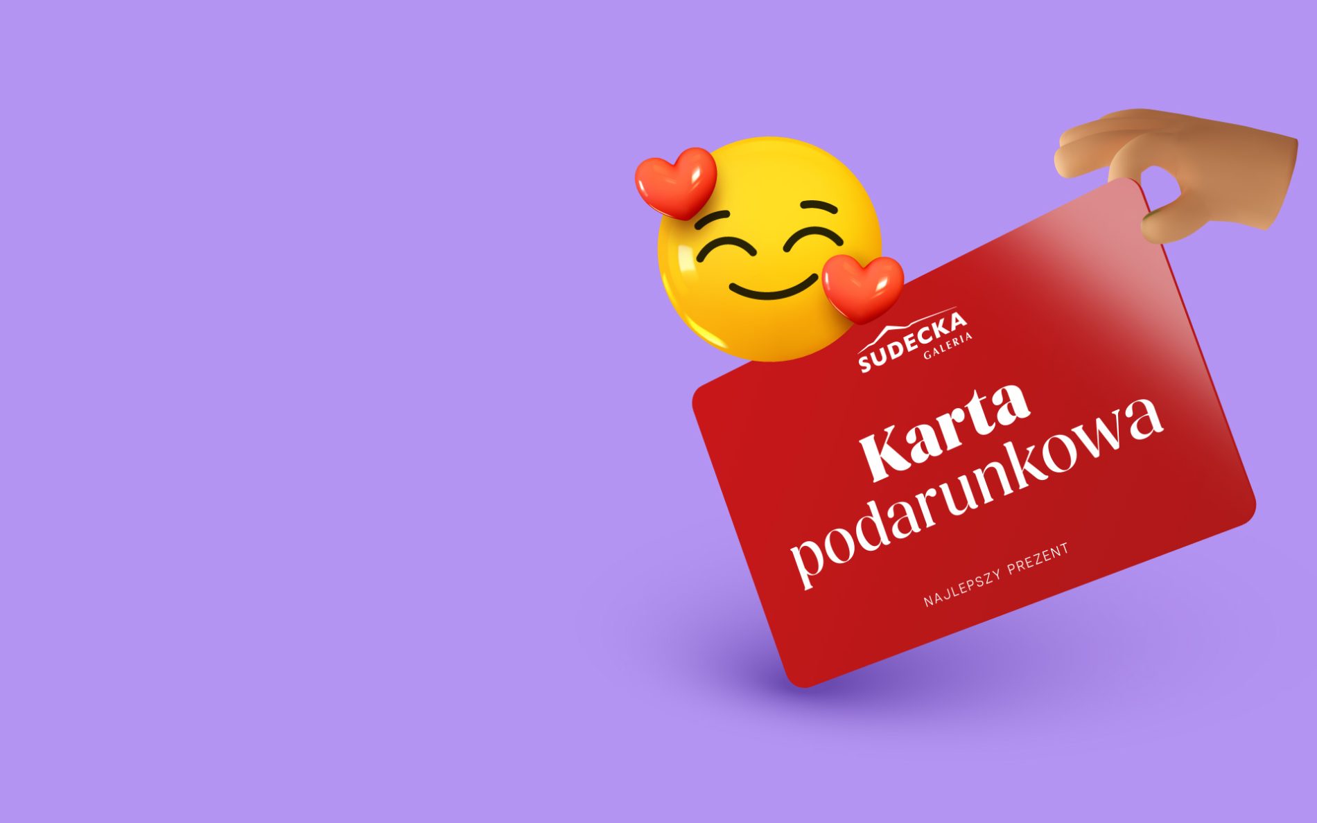 Żółta ikona emoji z serduszkami, a obok wizualizacja karty podarunkowej galerii sudeckiej. Grafika na fioletowym tle.